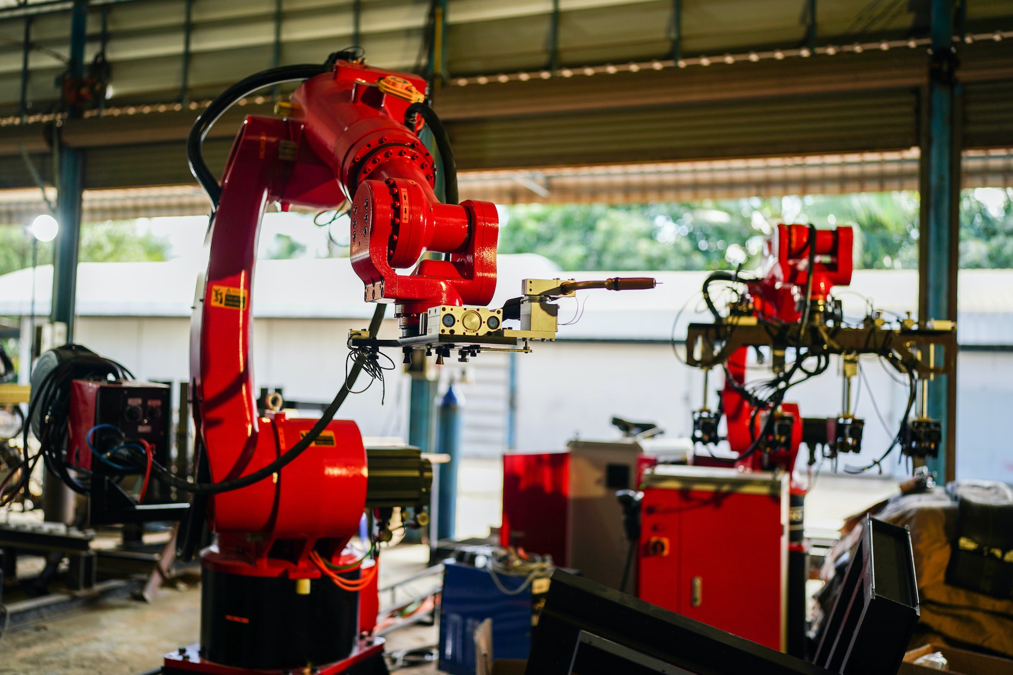 Robotics arm in the metal factory plant . it's the welding robotics units equipment.