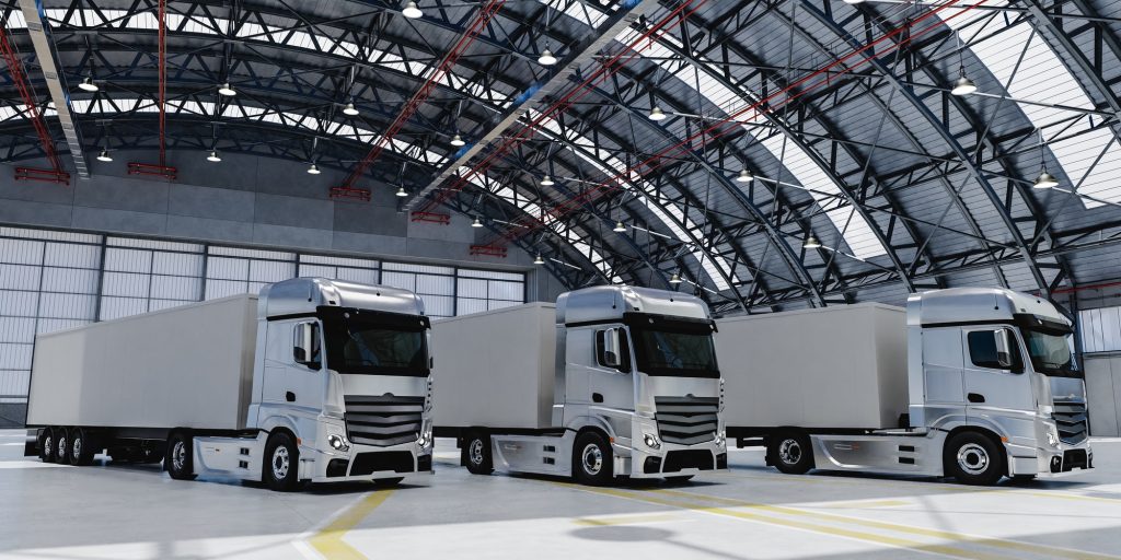 3D modern trucks parked in spacious warehouse
